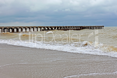 Old pier in stormy weather