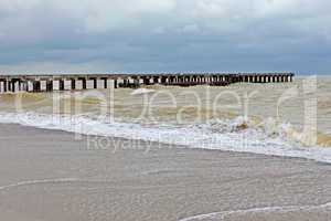 Old pier in stormy weather