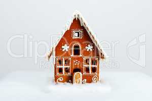 The hand-made eatable gingerbread house and snow decoration