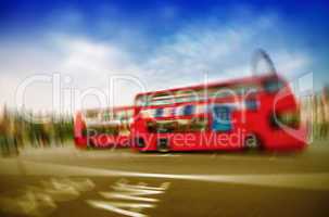 Blurred picture of fast moving double decker buses in London