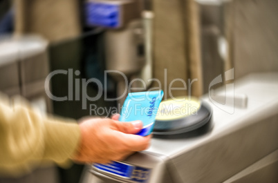 LONDON - SEPTEMBER 27, 2013: Man with Oyster Card, blurred scene