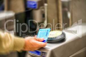 LONDON - SEPTEMBER 27, 2013: Man with Oyster Card, blurred scene