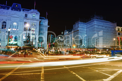 LONDON - SEPTEMBER 27, 2013: Tourists walk in Piccadilly area at