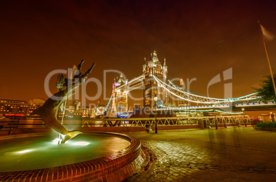 Dolphin Fountain and Tower Bridge at night, London