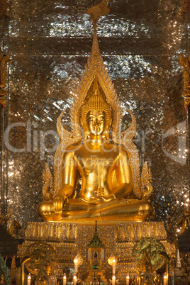 gold buddha statue in church at buddhist temple in Thailand