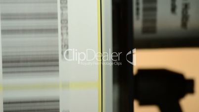 Barcode, label-generating machine in the foreground