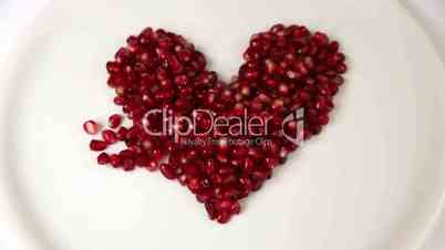 Heart Shaped Out Of A Pile Of Pomegranate Seeds
