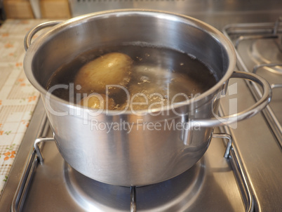 Saucepot with potatoes on cooker