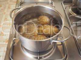 Saucepot with potatoes on cooker