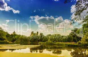 New York City Central Park on a sunny summer day with Manhattan