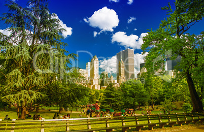 New York City Central Park on a sunny summer day with Manhattan