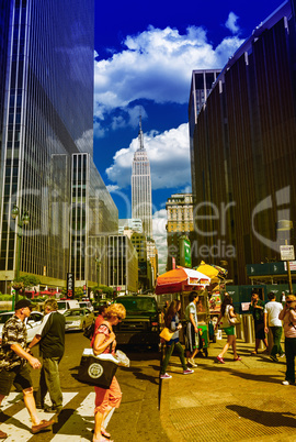 NEW YORK CITY - JUNE 14, 2013: Tourists walk along city streets