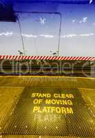Stand clear of moving platform sign in the subway
