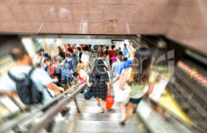 Blurred scene of fast moving crowd in subway station