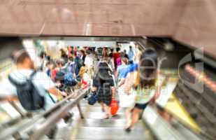 Blurred scene of fast moving crowd in subway station