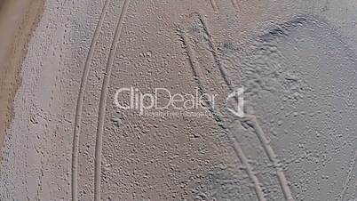 Many Footprints on Beach, aerial view
