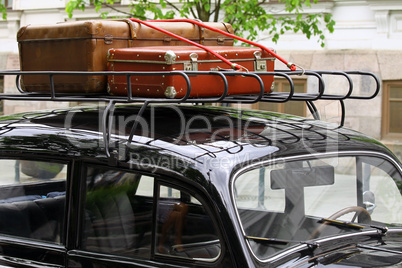 Vintage suitcases on the car roof