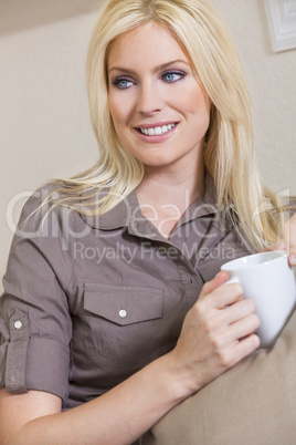 Woman Drinking Tea or Coffee At Home