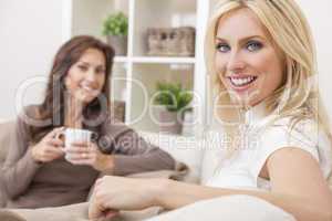 Two Women Friends Drinking Tea or Coffee at Home