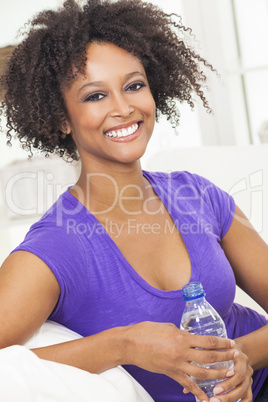 African American Woman Drinking Bottle of Water