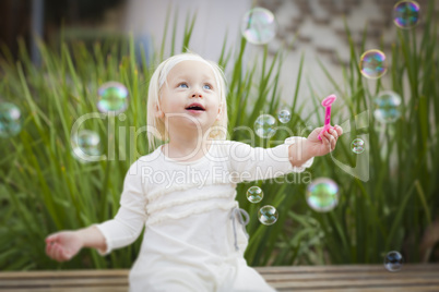 Adorable Little Girl Having Fun With Bubbles