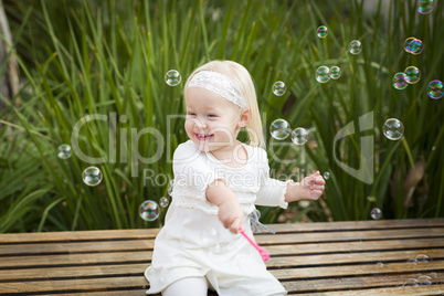 Adorable Little Girl Having Fun With Bubbles