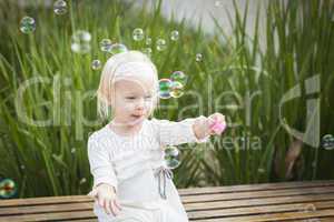 Adorable Little Girl Having Fun With Bubbles