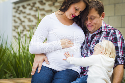 Adorable Baby Girl with Young Pregnant Parents