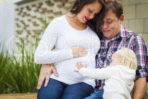 Adorable Baby Girl with Young Pregnant Parents