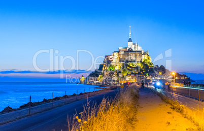 Mont Saint Michel at dusk, Normandy. City v iew woth famous Abbe