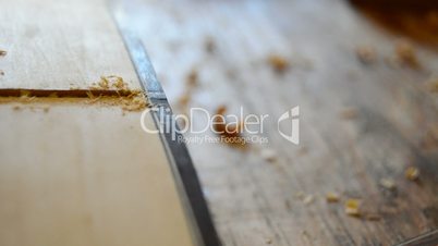 Chisel tool in close up manufacturing a guitar