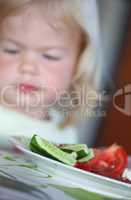 Portrait of sweet little girl having lunch