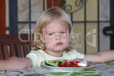 Portrait of sweet little girl having lunch