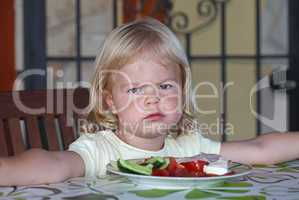 Portrait of sweet little girl having lunch