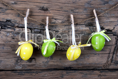Four Green And Yellow Easter Eggs