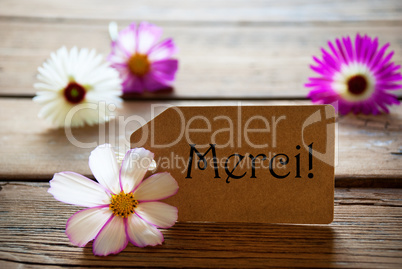 Label With French Text Merci With Cosmea Blossoms