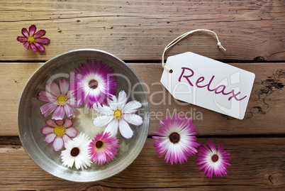 Silver Bowl With Cosmea Blossoms With Text Relax