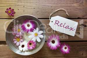 Silver Bowl With Cosmea Blossoms With Text Relax