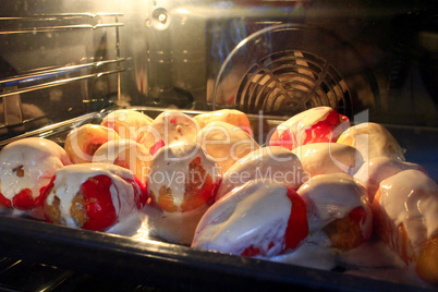 stuffed paprika cooking in the oven