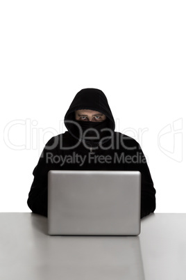 Hacker on silver laptop