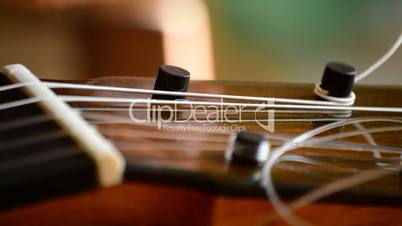 Placing the chord of a guitar, close up