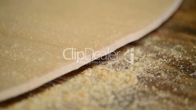 Luthier with a wood planer making wood shavings