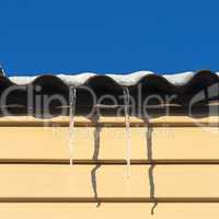 two icicles hanging from the roof