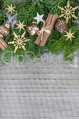 Christmas baubles, cinnamon, fir branches and stars