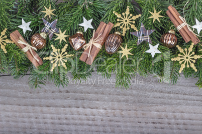 Christmas baubles, cinnamon, fir branches and stars