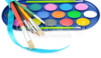 watercolor paints and brushes isolated on white background