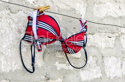 Red swimsuit on clothesline