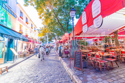 PARIS - JUNE 20, 2014: Tourists explore Montmartre streets at ni