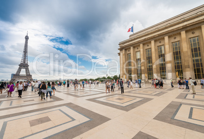 PARIS, FRANCE - JUNE 20, 2014: Tourists enjoy Eiffel Tower view