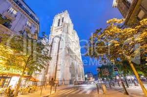 PARIS - JUNE 12, 2014: Tourists walk near Notre Dame. Paris is v
